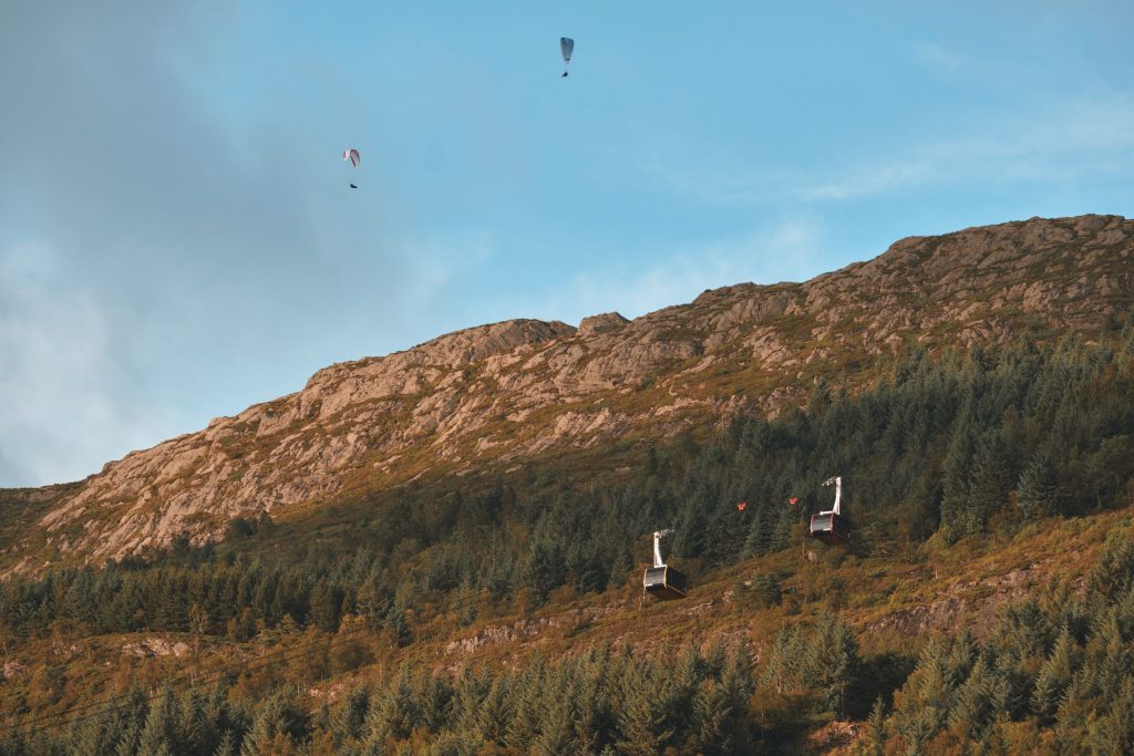 Recreation Outside Bergen Two paragliders flying above the Ulriken cable cars in Bergen