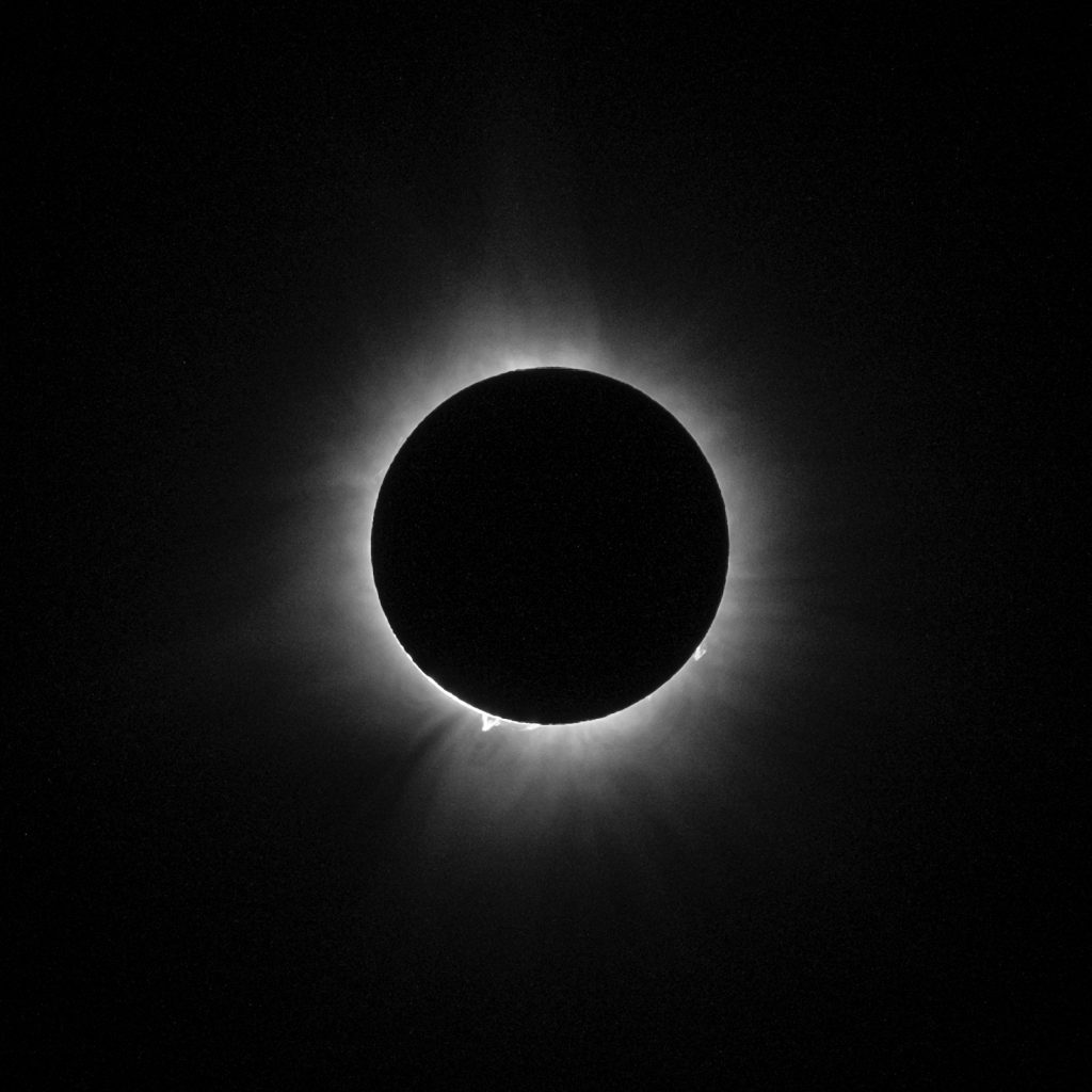 Eclipse Total solar eclipse, with a solar flare clearly visible